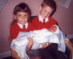 Emma with her brother and baby sister